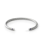 Polished sterling silver Blue Line Cuff with navy blue and white end details and engraved somethingaboutus logo.