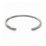 Polished sterling silver open cuff with parallel groove details near one end.